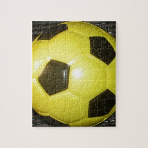 Lebendige gelbe und schwarze Fußball-Kunst Puzzle