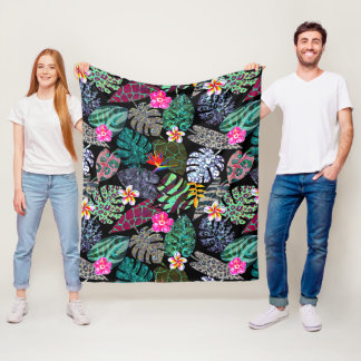 Lebendiges tropisches Blätter- und Blumenmuster Fleecedecke