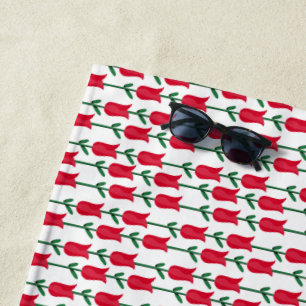 Lebhaftes rotes Blumenmuster mit üppig grünen Blät Strandtuch