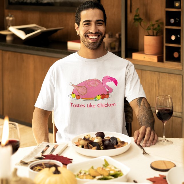 Lecker wie Chicken Funny Flamingo T-Shirt (male model at a holiday dinner wearing pink flamingo tastes like chicken funny t-shirt)