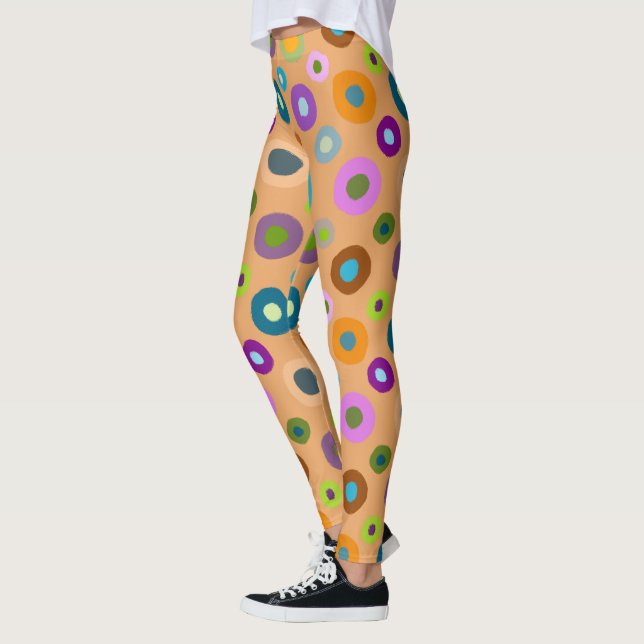 Leggings in farbenfrohen Punkten auf orange (Links)
