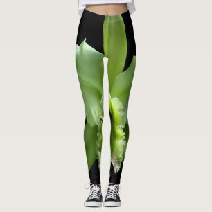 Leggings mit grüner Orchidee auf schwarzem Hinterg