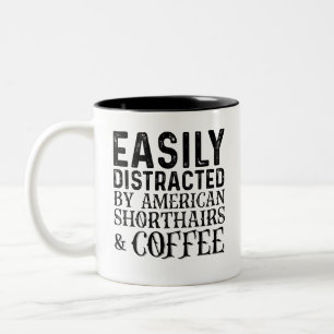 Leicht abgelenkt von amerikanischen Shiorthairs un Zweifarbige Tasse