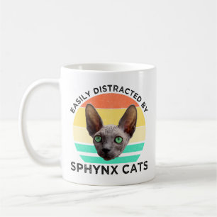 Leicht von Sphynxkatzen abgelenkt Kaffeetasse