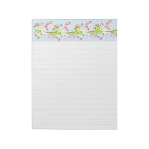 Leichte Feder auf einem großen Notepad Notizblock