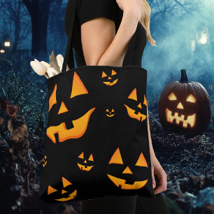Leuchtende Jack-O-Lantern-Gesichter zum Halloween-