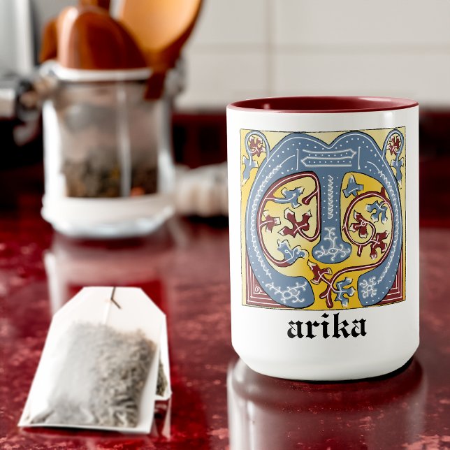 Leuchtender Brief des blauen und roten Lichts im M Tasse (Von Creator hochgeladen)