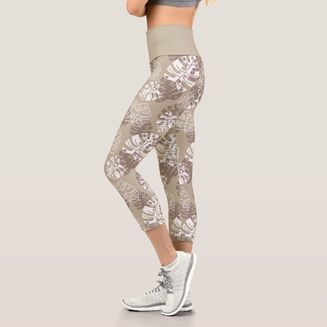 Leuchtendes Muster des braunen Botanischen Monster Capri Leggings (Links)