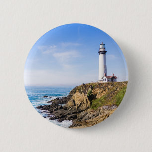 Leuchtturm auf dem Hügel blauer Himmel weißes Haus Button