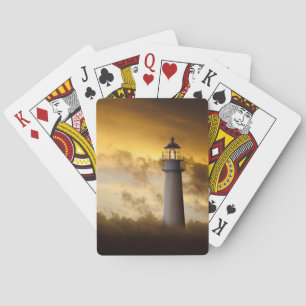 Leuchtturm, der unter drastischen Himmel glüht Spielkarten