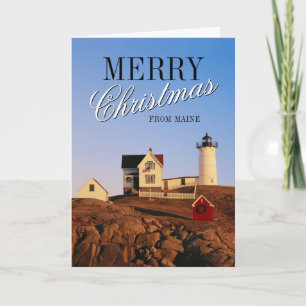 Leuchtturm im Sunset mit Weihnachtsdekorationen Feiertagskarte
