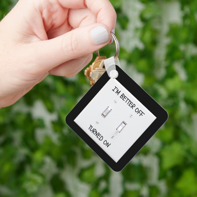 Lichtschalter an der Schlüsselkette eingeschaltet Schlüsselanhänger (Hand)
