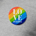 Liebe ist Liebe Pride Rainbow Button<br><div class="desc">Dieser Pride Button ist mit LIEBE IS LIEBE in fett-weißen Buchstaben auf einem wasserfarbenen Regenbogenhintergrund aus Rot,  Orange,  Gelb,  Grün,  Blau und lila dekoriert. Original Wasserfarbe © Michele Davies.</div>