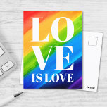 Liebe ist Liebe-Regenbogen-Stolz Postkarte<br><div class="desc">Dieser Gay Pride Postcard ist mit LIEBE IS LIEBE in fett-weißen Buchstaben auf einem Aquarelluntergrund aus Rot,  Orange,  Gelb,  Grün,  Blau und lila dekoriert. Original Wasserfarbe © Michele Davies.</div>