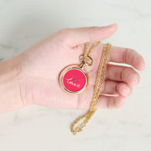 Liebe mit weißem Text auf rosa Armbanduhr