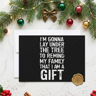 Liegen Sie unter dem lustigen Familien-Weihnachts- Feiertagskarte