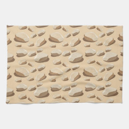 Light colored pebbles scattered on sand geschirrtuch