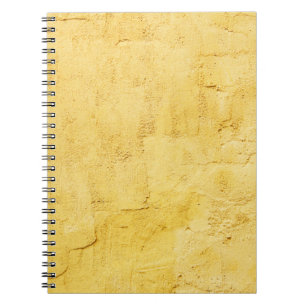 light yellow abstract textured plaster on the wall notizblock