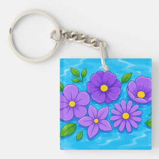 Lila Blüten mit grünen Blättern auf blauem Wasser Schlüsselanhänger