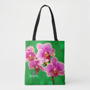 Lila Orchidee auf grüner Tragetasche