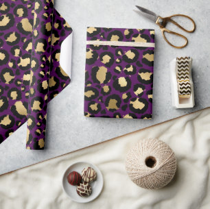 Lila- und Goldleopardruckpapier Geschenkpapier