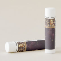 Lippenbalsam mit goldenem Blumenornament und Perle