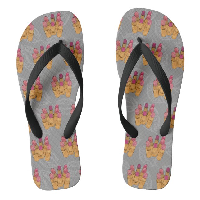 Lipstick-Array-Makeup in grauen Flip-Flops Flip Flops (Fußbett)