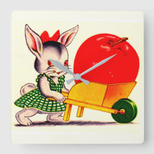 little bunny pushing cart with great big apple quadratische wanduhr
