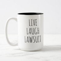 Live Laugh Klage, Anwalt Tasse, Verteidiger