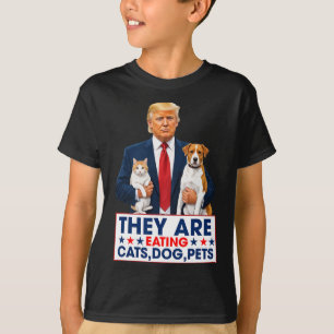 Lustig ist, dass sie die Hunde essen die Katzen di T-Shirt