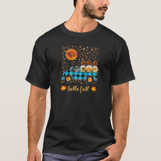 Lustige Gnome halten Kürbisse beim Fahren mit dem  T-Shirt