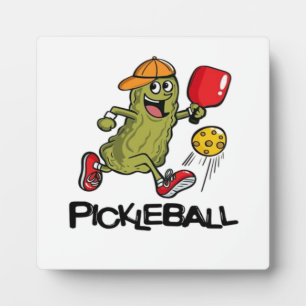 Lustige Gurke spielt Pickleball Fotoplatte