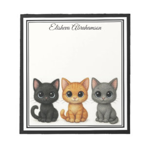 Lustige Katzen spähen Notizblock