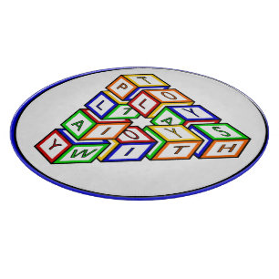 Lustige rote blaue gelbe grüne Kinder-Spielklötze Schneidebrett