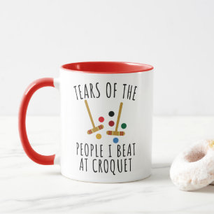 Lustige Tränen der Leute, die ich bei Croquet besi Tasse