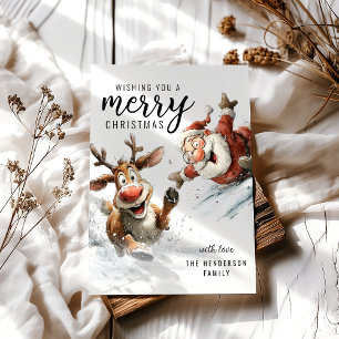 Lustige Weihnachtskarte mit Weihnachtsmann und Ren Feiertagskarte