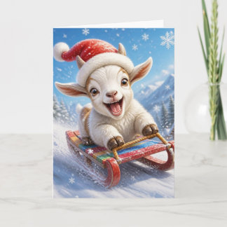Lustige Weihnachtsziege Schlittenfahren im Schnee Feiertagskarte