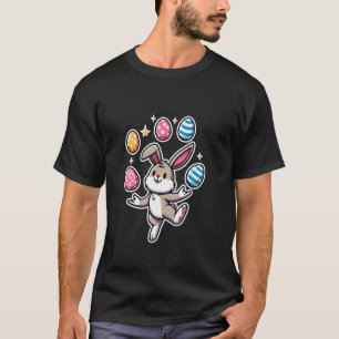 Lustiger niedlicher Osterhase jongliert bunte Eier T-Shirt
