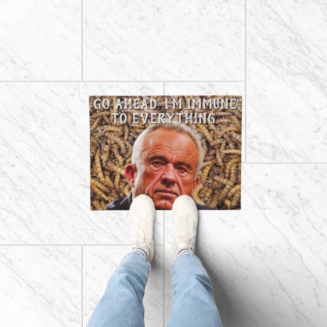 Lustiger rotgesichtiger Robert F. Kennedy Jr. und  Fußmatte (Indoor)