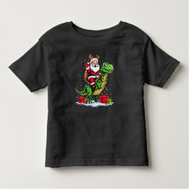 Lustiger Weihnachtsmann auf Dino mit Lichterkette Kleinkind T-shirt