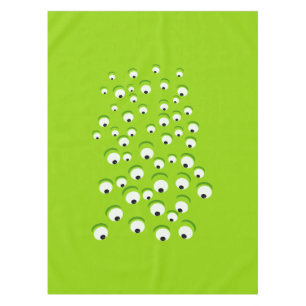 Lustiges verrücktes und neugieriges grünes mit tischdecke