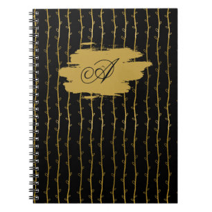 Luxuriöses schwarzes Notizbuch mit goldenem Blatt  Notizblock