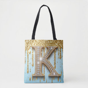 Luxus-Diamant-Buchstabe K auf goldenem Glitter-Hin