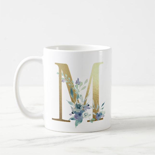 M, goldfarbener Erstling mit blauem Blumenblättern Kaffeetasse (Links)