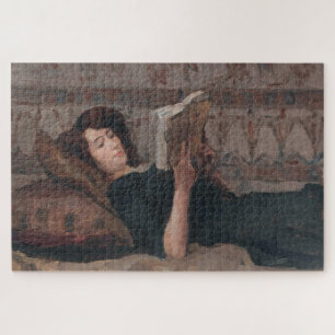 Mädchen beim Lesen eines Buches (Liegend auf einem Puzzle