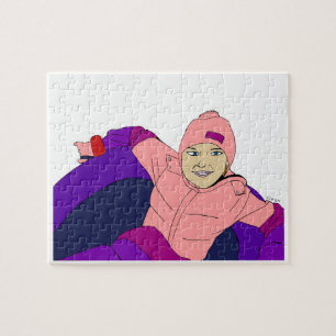 Mädchen beim Schneetubing Puzzle