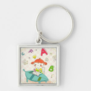 Mädchen, das auf dem Stuhl, studierend sitzt Schlüsselanhänger