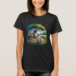 Mädchen liest unter einem Baum, umgeben von Blumen T-Shirt