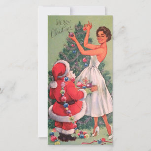 Mädchen schmückt Weihnachtsbaum im Vintage-Stil de Feiertagskarte