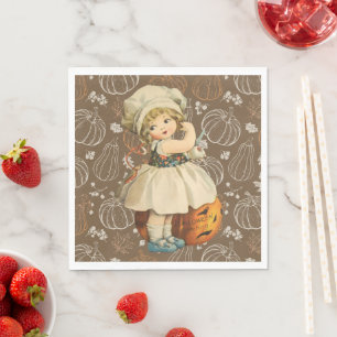 Mädchen schnitzt Halloween-Apfel Serviette